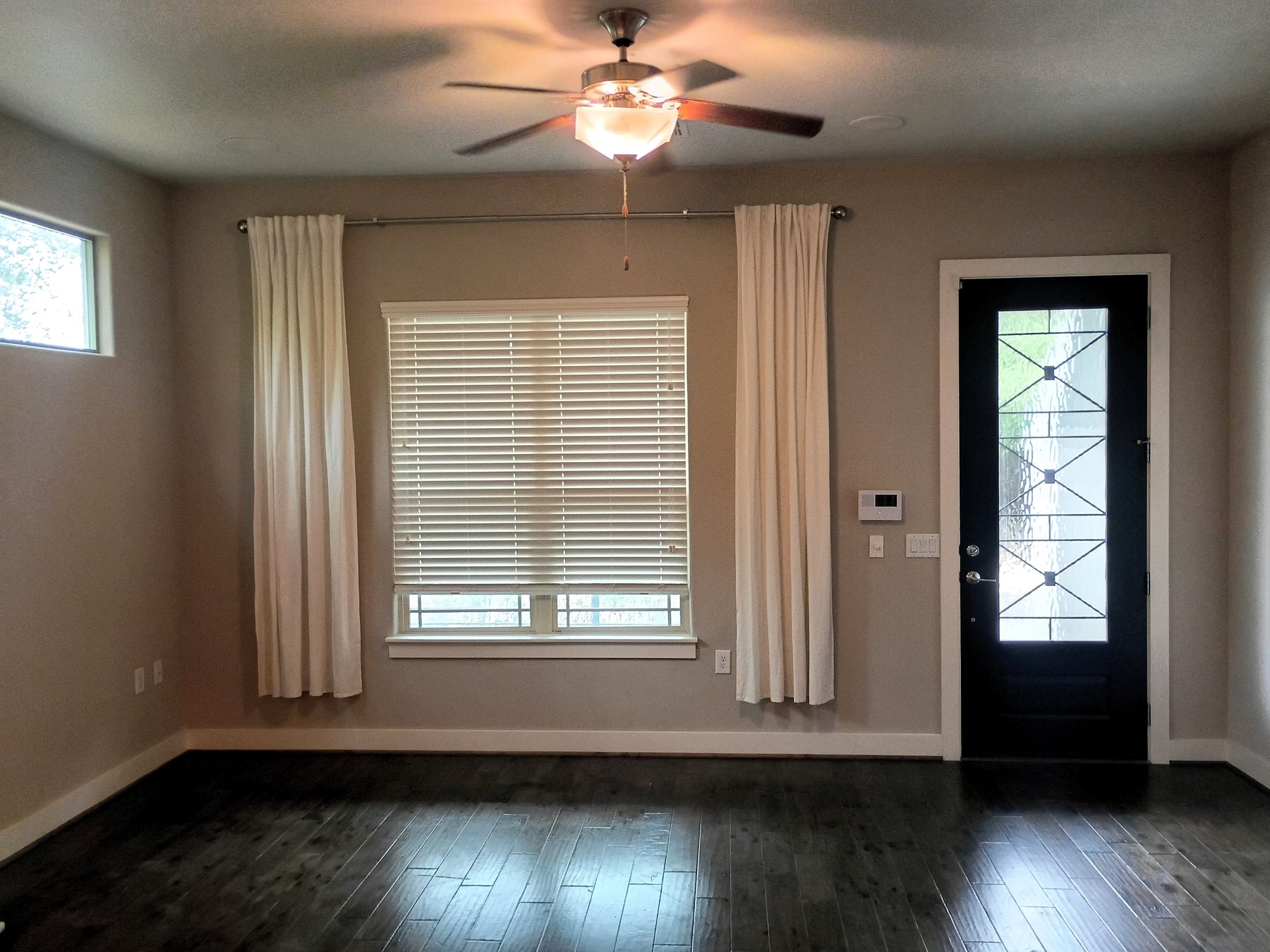 Entry room after paint and finish touch-ups completed during a residential make-ready in Austin.