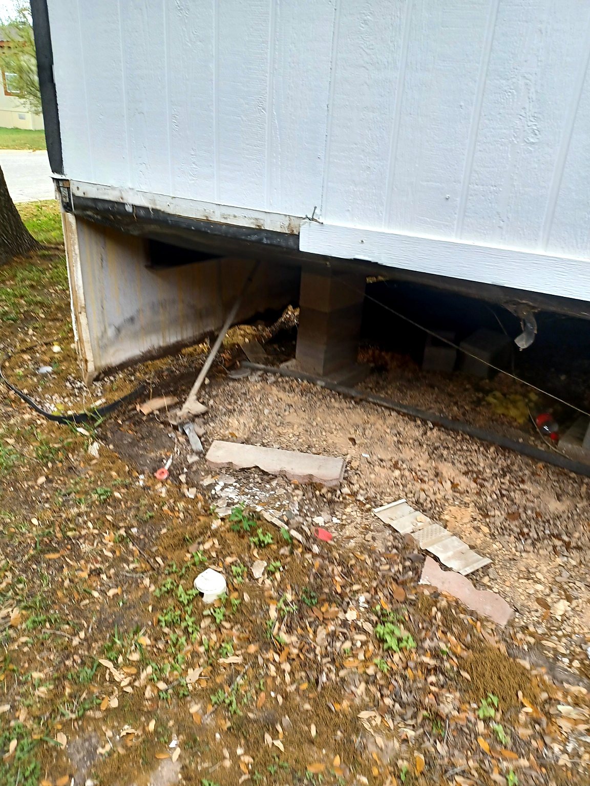 Exterior skirting repair in progress at an Austin-area manufactured home.